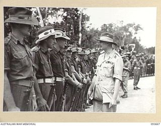 HONGORAI RIVER, BOUGAINVILLE, 1945-07-04. HIS ROYAL HIGHNESS, THE DUKE OF GLOUCESTER, GOVERNOR-GENERAL OF AUSTRALIA (1), SPEAKING TO MEMBERS OF 2 FIELD REGIMENT, WHILE VISITING FORWARD TROOPS OF ..