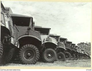 PORT MORESBY, PAPUA. 1944-08-16. AUSTRALIAN ARMY 15CWT 4 X 4 MOTOR VEHICLES LINED UP, IN THE ORDNANCE VEHICLE PARK OF THE 10TH ADVANCED ORDNANCE DEPOT, THESE ARE ONLY A FEW OF THE MANY HUNDREDS OF ..