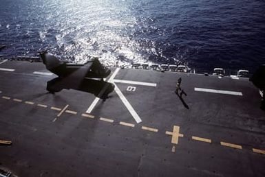 A CH-46 Sea Knight helicopter prepares for lift-off aboard the amphibious assault ship USS SAIPAN (LHA-2) during exercise Ocean Venture '81