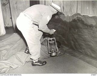 LAE AREA, NEW GUINEA. 1945-01-31. "THE SOLDIER'S DREAM" A SCENE DURING A PLAYETTE STAGED AT THE CAMPFIRE CONCERT OF THE 22ND WORKS COMPANY