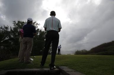 Barack Obama plays golf with Prime Minister Najib Razak, Joe Paulsen, and Mike Brush in Kaneohe Bay, Hawaii, December 24, 2014