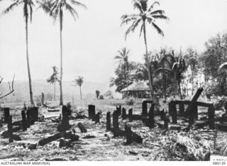 KOKODA, NEW GUINEA. 1942-12. DAMAGE CAUSED BY ALLIED AIRCRAFT AGAINST KOKODA