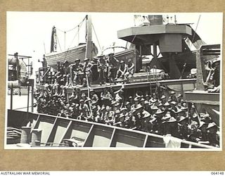 TOWNSVILLE, QUEENSLAND, AUSTRALIA. 1944-01-28. PERSONNEL OF THE 24TH INFANTRY BRIGADE ABOARD THE TROOPSHIP "VAN HEUTSZ" IMPATIENTLY WAITING TO LAND IN AUSTRALIA AFTER A LONG TOUR OF DUTY IN NEW ..