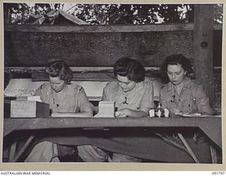LAE, NEW GUINEA. 1945-05-15. AUSTRALIAN WOMEN'S ARMY SERVICE PERSONNEL AT THE CAMP COMMANDANT'S OFFICE HEADQUARTERS FIRST ARMY MAKING OUT CIGARETTE RATION CARDS. A FEW DAYS AFTER THEIR ARRIVAL FROM ..