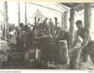 SIAR, NEW GUINEA. 1944-09-11. TROOPS OF THE 113TH BRIGADE WORKSHOPS INSTALLING MACHINERY IN THEIR NEWLY COMPLETED WORKSHOPS