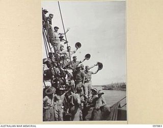 OFF BORAM BEACH, NEW GUINEA. 1945-10-13. THE FIRST BATCH OF TROOPS TO LEAVE THE WEWAK AREA UNDER THE PRIORITY DEMOBILISATION SCHEME WERE MEMBERS OF 6 DIVISION. SHOWN, TROOPS ALREADY EMBARKED ON ..
