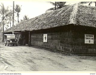 HAGITA, MILNE BAY, NEW GUINEA. 1944-04-04. THE AUSTRALIAN COMFORTS FUND BULK STORE AT HAGITA, COMPRISING ADMINISTRATIVE OFFICES FOR THE AREA, LIVING QUARTERS, AND CLUB ROOM, WAS CONSTRUCTED BY ..