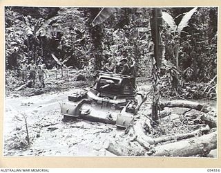 TOROKINA, BOUGAINVILLE, 1945-08-02. A MATILDA TANK BOGGED DOWN IN A SWAMP DURING TRIALS OF THE M24 GENERAL CHAFFEE LIGHT TANK CONDUCTED FOR THE WAR OFFICE