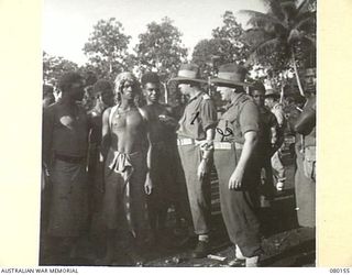 NEW GUINEA. 1944-06-29. NX201 MAJOR H.E. GALE, MBE, WITH NX8798 CAPTAIN C.F. BRADY AT HEADQUARTERS NEW GUINEA FORCE DETAILING NATIVE LABOUR TO DUTIES