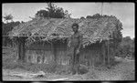 Man in front of house