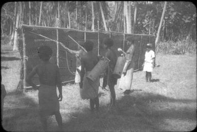 Jonathan Baloiloi training the spraymen : D'Entrecasteaux Islands, Papua New Guinea, 1956-1959 / Terence and Margaret Spencer