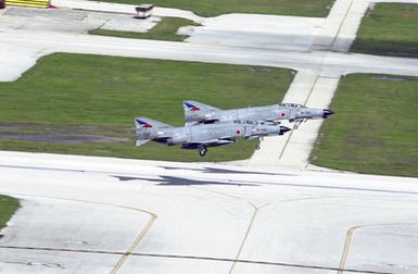 Two Japanese Air Self Defense Force (JASDF), F-4 Super Phantoms, 83rd Wing, Naha Airport, Okinawa, take off from Andersen Air Force Base (AFB), Guam, during Exercise COPE NORTH. COPE NORTH is an exercise that includes troops from the US Air Force, US Marines, and US Navy training with troops from the Japanese Air Self Defense Force (JASDF)