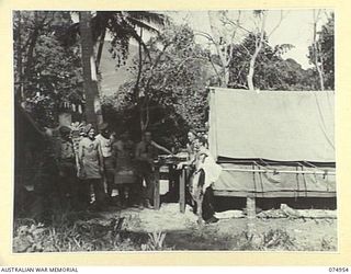 HANSA BAY, NEW GUINEA. 1944-07-29. GENERAL VIEW OF THE 30TH INFANTRY BATTALION FIELD BAKERY AND STAFF. IDENTIFIED PERSONNEL ARE:- NX122078 PRIVATE A. BRUCE (1); NX190356 PRIVATE W.L. HYDE (2); ..