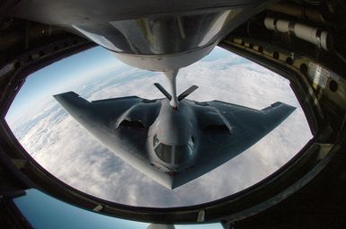 Over the Pacific Ocean a US Air Force (USAF) B-2 Spirit bomber, 509th Bomber Wing (BW), Whiteman Air Force Base (AFB), Missouri (MO), refuels from an Illinois Air National Guard (ILANG) KC-135 Stratotanker, 126th Air Refueling Wing (ARW), Scott AFB, during a deployment to Andersen Air Force Base (AFB), Guam (GU). The bomber deployed as part of a rotation that has provided US Pacific Command (USPACOM) officials a continuous bomber presence in the Asia-Pacific region, enhancing regional security and the US commitment to the Western Pacific