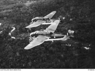 NEW GUINEA, 1943-04. BEAUFORT BOMBERS OF NO. 100 SQUADRON FLYING OVER JUNGLE COUNTRY