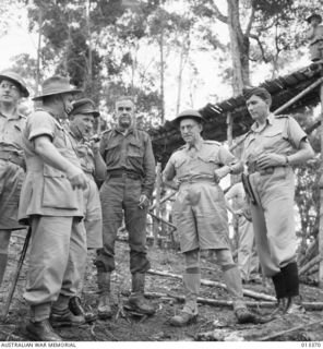 1942-10-08. IN THIS GROUP "SOMEWHERE IN NEW GUINEA" ARE (LEFT TO RIGHT) GENERAL BLAMEY: AN AUSTRALIAN GENERAL: MR DRAKEFORD AND AIR VICE MARSHAL G. JONES. (NEGATIVE BY BOTTOMLEY)