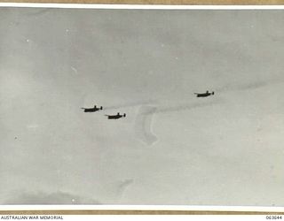 FARIA RIVER, NEW GUINEA. 1944-01-20. MITCHELL BOMBERS MOVING INTO ATTACK JAPANESE POSITIONS ACROSS MAIN CREEK