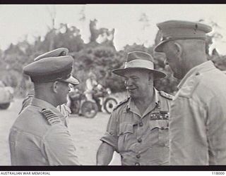 Torokina, Bougainville. 1945-10-29. General Sir Thomas A. Blamey (second from right), Commander in Chief, Australian Military Forces, chatting with Group Captain (Gp Capt) J. A. Cohen RAAF (second ..