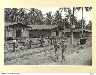 MILNE BAY SUB AREA, NEW GUINEA, 1944-02-09. THE STAFF MESS (LEFT), THE OFFICERS' MESS (CENTRE), AND THE OFFICERS' QUARTERS (EXTREME RIGHT), AT THE RECEPTION AND GENERAL DETAILS DEPOT. THE WATER ..