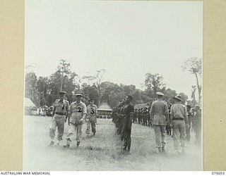 LAE, NEW GUINEA. 1944-09-09. VX13 LIEUTENANT-GENERAL S.G. SAVIGE, CB, CBE, DSO, MC, ED, NEW GUINEA FORCE (2) ACCOMPANIED BY NGX302 CAPTAIN R.H. HICKS OFFICER- IN- CHARGE, ROYAL PAPUAN CONSTABULARY, ..