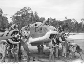 TADJI NEAR AITAPE, NORTH EAST NEW GUINEA. C. 1944-10. MECHANICS, FITTERS, AND ARMOURERS OF NO. 8 SQUADRON RAAF, WHO HAVE DONE A GREAT JOB WITH BEAUFORT SQUADRONS SWARM OVER A BOMBER AIRCRAFT BEING ..