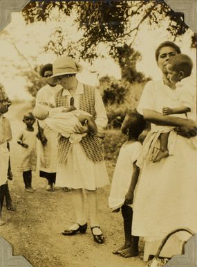 Ethel Vickery holding a baby at the Methodist Mission, Davuilevu, Fiji, 1928