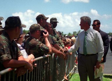 President William Jefferson Clinton shakes hands with members of the 15th Civil Engineering Squadron at the ceremonies to commemorate the 50th anniversary of the end of World War II