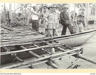 WANIGELA, NEW GUINEA. 1942-10. GENERAL SIR THOMAS BLAMEY GBE KCB CMG DSO ED, COMMANDING ALLIED LAND FORCES, SOUTH WEST PACIFIC AREA, INSPECTING A NATIVE CANCE WHICH WAS SUGGESTED AS A POSSIBLE ..