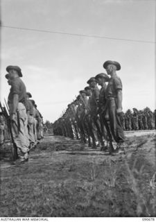 AITAPE, NEW GUINEA. 1945-04-17. A SECTION OF 2/6 CAVALRY (COMMANDO) REGIMENT TROOPS ON PARADE FOR INSPECTION BY MAJOR GENERAL J.E.S. STEVENS, GENERAL OFFICER COMMANDING 6 DIVISION. THE PARADE WAS ..