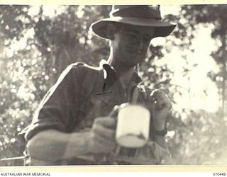 FARIA RIVER, NEW GUINEA, 1944-02-15. V122194 PRIVATE L.A. TANIAN OF 13 PLATOON, "C" COMPANY 57TH/60TH INFANTRY BATTALION, ON HIS WAY UP THE FARIA RIVER WITH THE PLATOON TO THE PROTHERO FEATURES IN ..