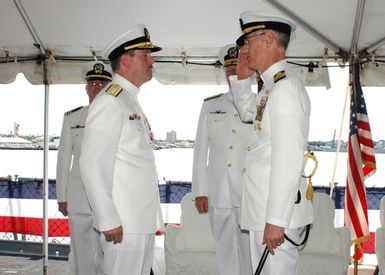 U.S. Navy CAPT. Christopher Mossey (right), renders a salute to Rear Adm. Gary Engle, as he accepts command of the Naval Facilities Engineering Command Pacific, during a Change of Command Ceremony aboard the decommissioned Iowa Class Battleship, USS MISSOURI (BB 63) at Naval Station Pearl Harbor, Hawaii, on Oct. 20, 2006. (U.S. Navy PHOTO by CHIEF Mass Communication SPECIALIST Don Bray) (Released)