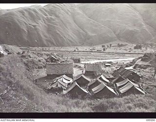 WAU-LABU ROAD, NEW GUINEA, 1946-01-12. THE PLATOON CAMP OF 8 MECHANICAL EQUIPMENT COMPANY, ROYAL AUSTRALIAN ENGINEERS, AT MUMERG, FIFTY-FIVE MILES FROM LABU, OVERLOOKING THE SNAKE RIVER