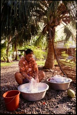 Okilua Dean does the family wash, Rakahanga, Cook Islands