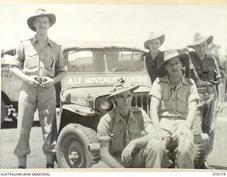 FINSCHHAFEN, NEW GUINEA. 1944-09-20. PERSONNEL OF THE 8TH MOVEMENT CONTROL GROUP, (DRAGER DETACHMENT), AT THE AIRFIELD ALONGSIDE THEIR JEEP. IDENTIFIED PERSONNEL ARE:- VX102815 SERGEANT J.W. ..