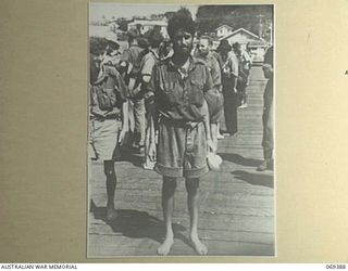 PORT MORESBY, NEW GUINEA. 1942-04-12. ONE OF THE EVACUEES, WHO WITH 155 OTHERS, COMPRISING SERVICE PERSONNEL AND CIVILIANS, WAS SUCCESSFULLY WITHDRAWN FROM PALMALMAL ON THE SOUTH COAST OF NEW ..