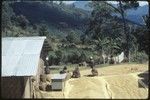 Coffee beans being weighed for sale outside a trade store in Tabibuga