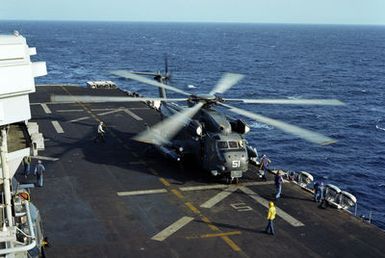 A CH-53 Sea Stallion helicopter prepares to take off from the flight deck of the amphibious assault ship USS GUAM (LPH 9) during flight operations off the coast of Beirut. The ship is providing support to US Marines deployed in Lebanon as part of a multi-national peacekeeping force following confrontation between Israeli forces and the Palestine Liberation Organization