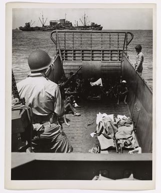 Photograph of Captured Japanese Soldiers and Korean Laborers Being Taken Via Tank Lighter to a Coast Guard-manned Combat Transport