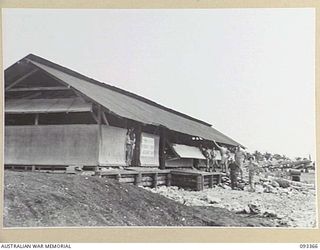 JACQUINOT BAY, NEW BRITAIN, 1945-06-24. ADMINISTRATION BUILDINGS AT JACQUINOT AIRSTRIP, MANNED BY 8 MOVEMENT CONTROL GROUP (G DETACHMENT), RAAF AND RNZAF