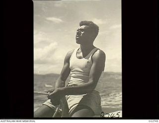 PORT MORESBY, PAPUA. C. 1944. A PAPUAN NATIVE EMPLOYED AS A CREW MEMBER ON A SAILING VESSEL USED BY THE RAAF RESCUE SERVICE