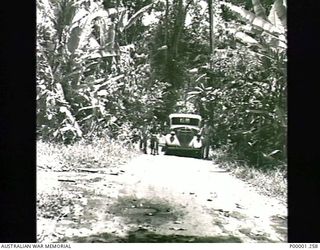 THE SOLOMON ISLANDS, 1945-10-11. AN ABANDONED JAPANESE TRUCK FOUND ON A JUNGLE ROAD ON BOUGAINVILLE ISLAND. (RNZAF OFFICIAL PHOTOGRAPH.)