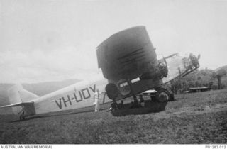 WAU, NEW GUINEA, 1940-06?. FORD MODEL 4-AT-E TRIMOTOR, CALL SIGN VH-UDY, AT WAU AERODROME. THIS AIRCRAFT WAS DELIVERED TO HOLDEN'S AIR TRANSPORT SERVICES IN NEW GUINEA IN 1935, SERVING WITH ..