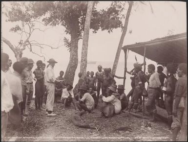 Bishop Wilson reading the governors despatch to local people at Ahia, Solomon Islands, 1906, 1 / J.W. Beattie