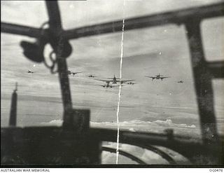 AIRBORNE NEAR LINDENHAFEN, NEW BRITAIN. 1944-01-17. VIEW THROUGH THE NOSE OF A BEAUFORT BOMBER AIRCRAFT. BEAUFORT BOMBER AIRCRAFT OF NOS 6, 8 AND 100 SQUADRONS RAAF TOOK PART IN A MASSED DAYLIGHT ..