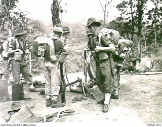 THE SOLOMON ISLANDS, 1945-03-27. AUSTRALIAN SOLDIERS READY TO LEAVE THEIR CAMP ON THE NUMA NUMA TRAIL ON BOUGAINVILLE ISLAND. (RNZAF OFFICIAL PHOTOGRAPH.)