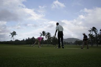 Barack Obama plays golf with Prime Minister Najib Razak, Joe Paulsen, and Mike Brush in Kaneohe Bay, Hawaii, December 24, 2014
