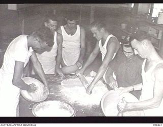 TOROKINA, BOUGAINVILLE, 1945-10-27. MEMBERS OF THE COOKING AND CATERING STAFF, WHO ARE ALSO INSTRUCTORS AT THE TOROKINA REHABILITATION TRAINING CENTRE. IDENTIFIED PERSONNEL ARE: PRIVATE (PTE) R. G. ..