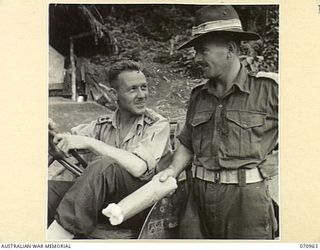 ZENAG, NEW GUINEA, 1944-02-28. NX76577 CAPTAIN N.F. HATCHER (1), OFFICER COMMANDING NO. 4 PLATOON, 2/1ST MECHANICAL EQUIPMENT COMPANY, WITH NX135072 LIEUTENANT E.T. CALTHORPE (2), SECOND IN COMMAND ..