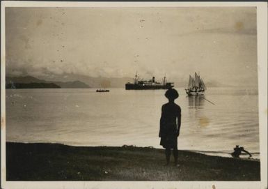 Malaua on beach with the Burns Philp ship the Montoro and a ketch in the harbour, Salamaua, New Guinea, 1933 / Sarah Chinnery