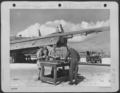 After The First Bombing Mission Over Tokyo, Japan, Gunners Clean Their Guns And Mechanics Check Over One Of The Boeing B-29 "Superfortresses"' Which Took Part In The Mission. Saipan, Marianas Islands, November 1944. (U.S. Air Force Number 64284AC)